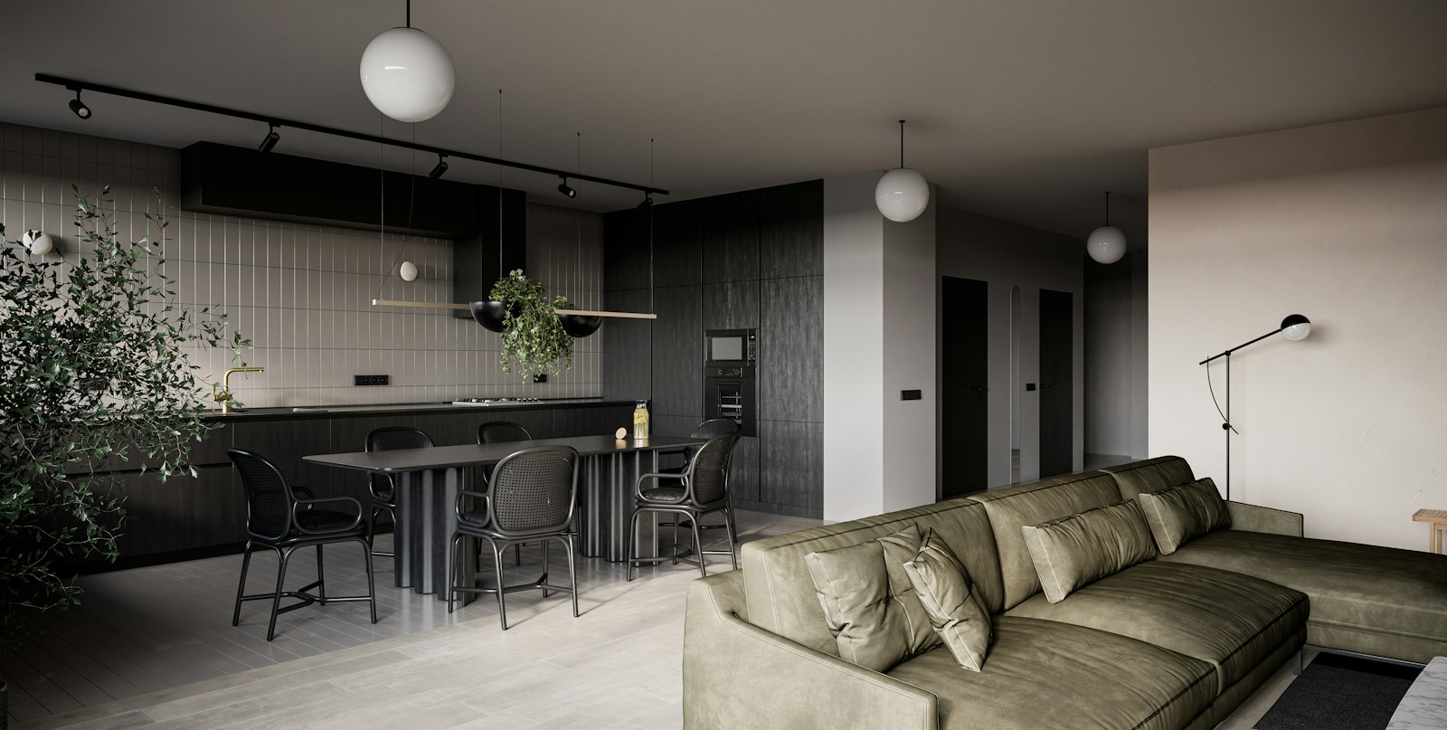 Wohn- und Essbereich mit grünem Sofa, Tisch und Küchenzeile